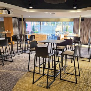 Add height in your Reception area with black Kansas stools and Dallas square tables.